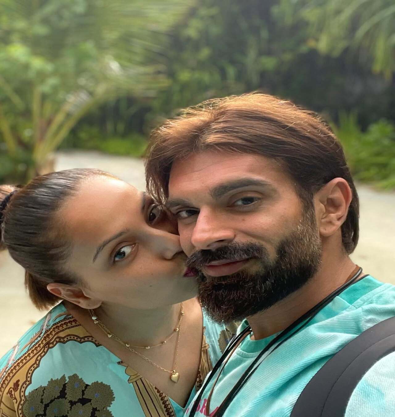 The duo love to travel and are often seen jetting off to beachside destinations. Here, Bipasha places a gentle kiss on Karan's cheek during one of their holidays